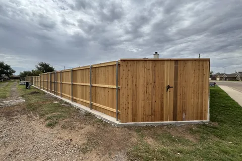 7ft capped cedar privacy fence installed by Hudson Fence Company in Lubbock, TX